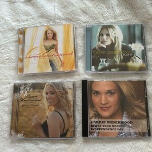 4 Carrie Underwood CDs.